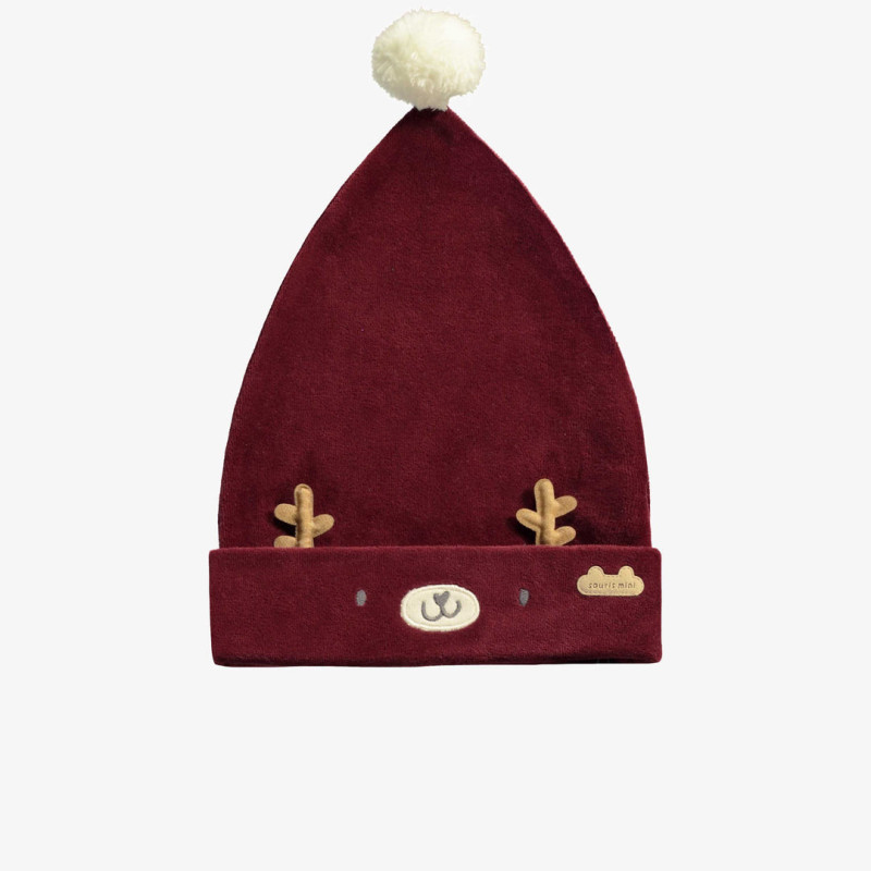 Red hat with reindeer face and a pompom in velvet, newborn