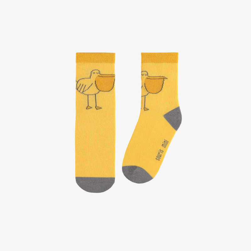 Yellow socks with a funny pelican, child