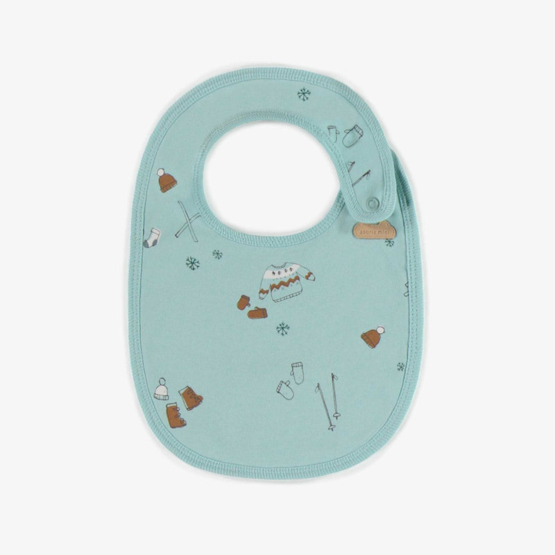 Light blue bib with a skiing theme in organic cotton, newborn